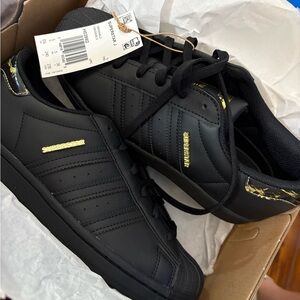 Adidas Superstar Black and Gold Sneakers